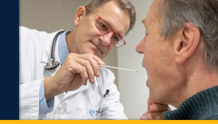 doctor taking cheek swab