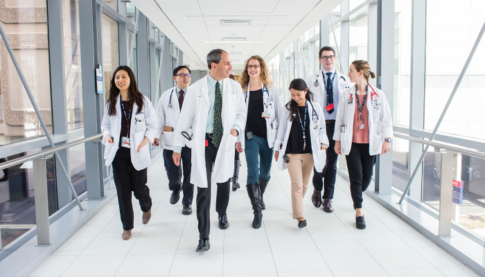 clinicians walking in hallway