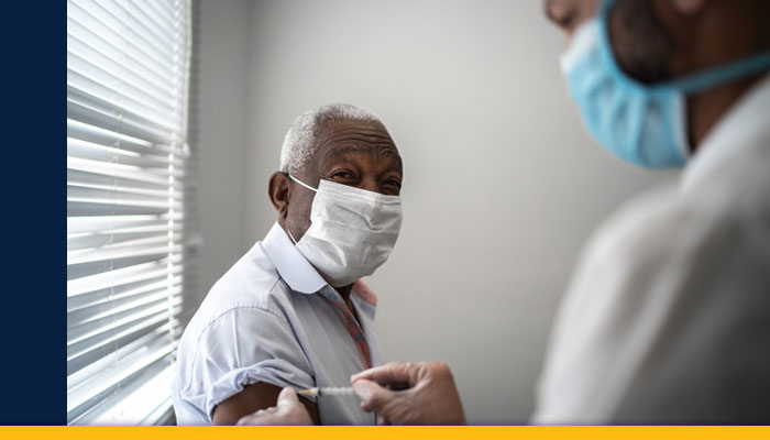 patient in mask with doctor