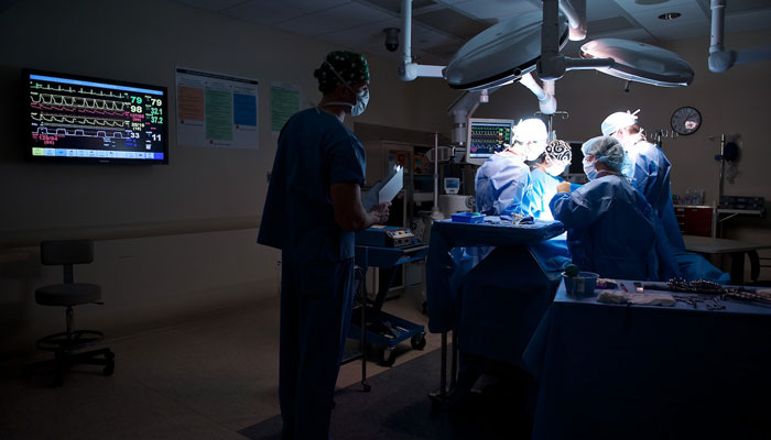 medical professionals in operating room during procedure