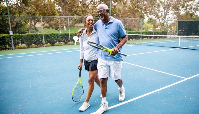Couple playing tennis