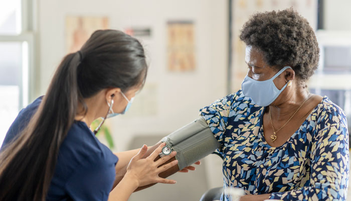 patient having blood pressure checked