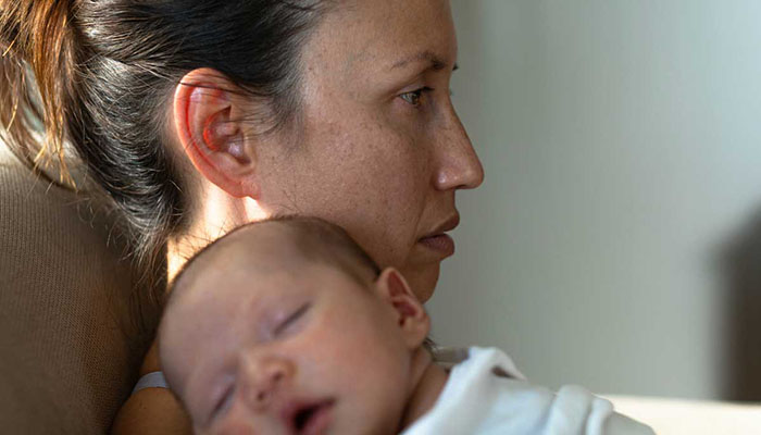 Mother holding newborn baby