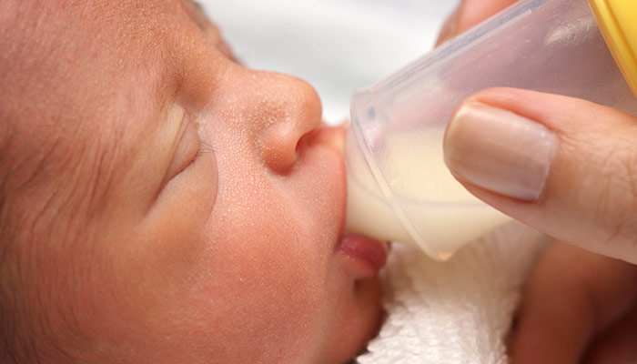 Image of a baby drinking a bottle