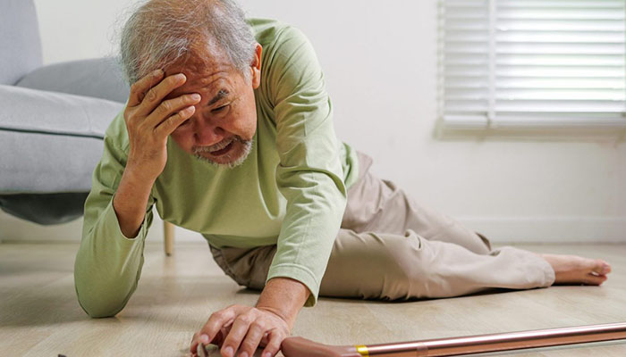 Man laying on ground after fall