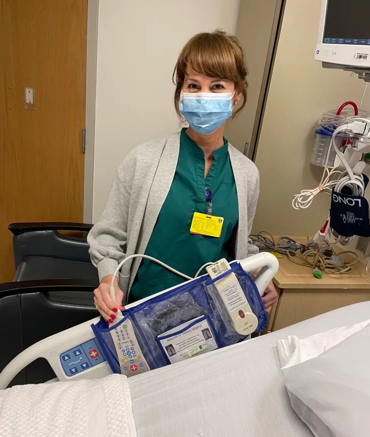 Kim Ladouceur, RN, nurse in charge for Braunwald Tower 11ABD, demonstrates the bedside organizer.