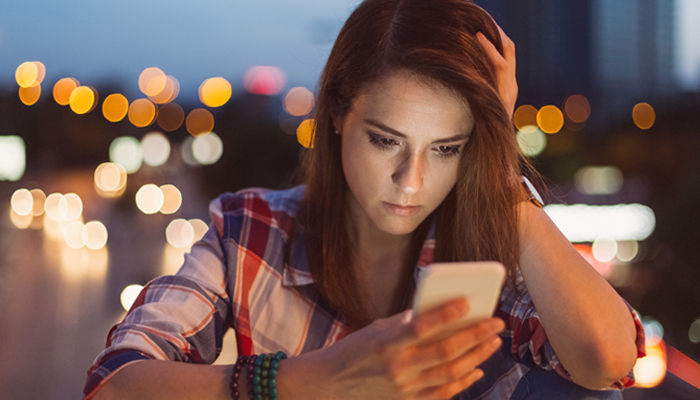 Woman looking at smart phone