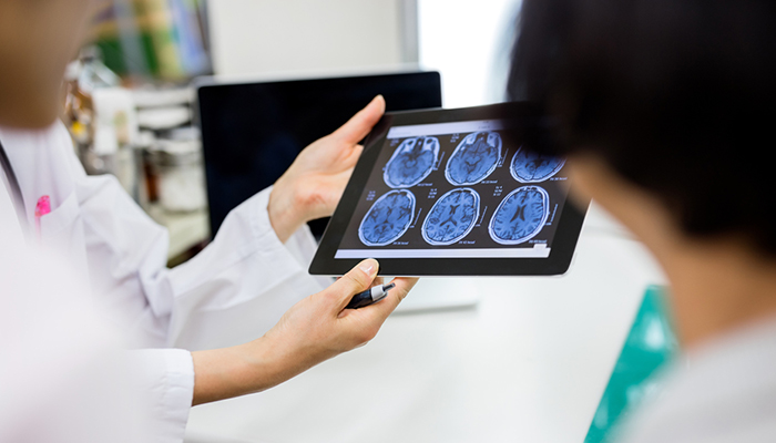 Providers looking at brain scans